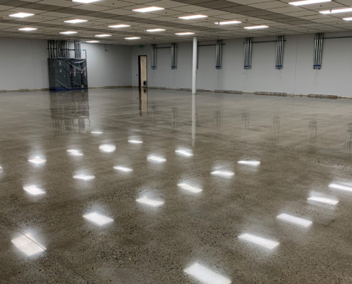 Side view of commercial room with shiny polished concrete floors