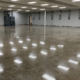 Side view of commercial room with shiny polished concrete floors