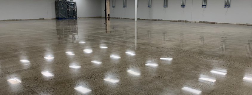 Side view of commercial room with shiny polished concrete floors