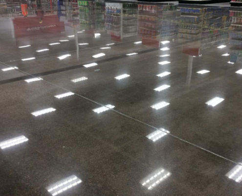 Front view of polished concrete floor in supermarket retail store